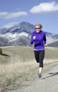 Woman in her fifties running in Montana Royalty Free Stock Photo