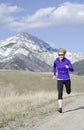 Woman in her fifties running in Montana Royalty Free Stock Photo