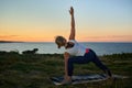 woman in her forties doing yoga at sunrise Royalty Free Stock Photo