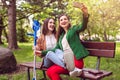 Woman and her friend with a sprained ankle taking a photo