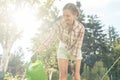 Woman in her garden watering fruit tree Royalty Free Stock Photo