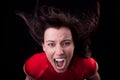 Woman with her hair in wind,screaming in fury Royalty Free Stock Photo