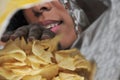 Woman eating potato chips Royalty Free Stock Photo