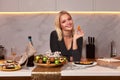 A woman with her hands eats a large appetizing shrimp. Selective focus.