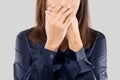 Woman with her hands on her mouth because of bad breath or halitosis Royalty Free Stock Photo