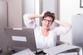 Woman in her homeoffice has stressy moment