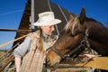 Woman and her horse at farm Royalty Free Stock Photo