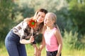 Woman and her little daughter playing in park Royalty Free Stock Photo