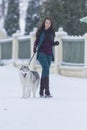 Woman and Her Lovely Husky Dog Taking a Stroll Together