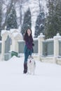 Woman and Her Lovely Husky Dog Taking a Stroll Together Outside