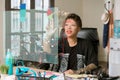 Woman in her Office Accessing Information from a Futuristic Financial Chart