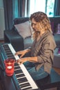 Woman and her piano in home