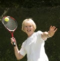 Woman in her sixties playing tennis