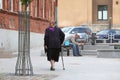 Woman with her walking stick Royalty Free Stock Photo