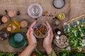 woman and herbal tinctures, tea, medicinal herbs. Royalty Free Stock Photo