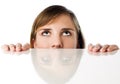 Woman hiding behind table Royalty Free Stock Photo