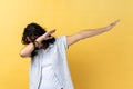 Woman , hiding face with dab dance move, performing internet meme of success, dabbing trends.