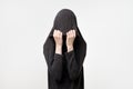 Woman hiding face under the clothes. She is oulling sweatr on her head. Depressed emotion. Royalty Free Stock Photo