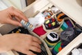 Woman hiding money in drawer with socks. Financial savings Royalty Free Stock Photo