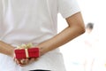 Woman hiding red gift cox Royalty Free Stock Photo