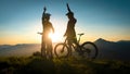 Woman high five over the sunset at mountain biking trip Royalty Free Stock Photo