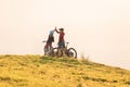 Woman high five over the sunset at mountain biking trip Royalty Free Stock Photo