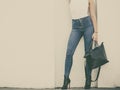 Woman in high heels shoes holds handbag Royalty Free Stock Photo