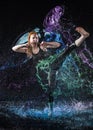 Woman High Kicking in Colorful Water Splashes Royalty Free Stock Photo