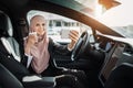 Woman in hijab having video call on mobile inside car Royalty Free Stock Photo