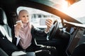 Woman in hijab having video call on mobile inside car Royalty Free Stock Photo