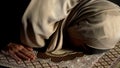 Woman in hijab prostrating on prayer rug, obligatory religious ritual, worship Royalty Free Stock Photo