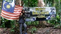 Woman hiker arrived at the peak of Wave Rock at Bukit Baginda Majau in Negeri Sembilan.