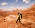 Woman Hiker with backpack enjoy view in desert