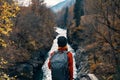 woman hiker backpack mountains river fresh air