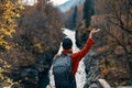 woman hiker backpack mountains river fresh air