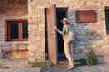 Woman hiker camping near the beautiful shelter stone hut building in Pyrenees mountains. Hiking and adventure concept Royalty Free Stock Photo