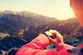 Woman hiker checking the altimeter on sports watch Royalty Free Stock Photo