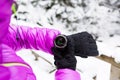 Woman hiker checking sports watch in winter woods and mountains Royalty Free Stock Photo