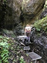 Woman hiker climbs stairs up to the gorge Royalty Free Stock Photo