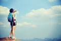 Woman hiker drinking water at sunset mountain Royalty Free Stock Photo