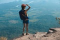 Woman hiker enjoy the view on cliff edge top of mountain Royalty Free Stock Photo