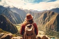 woman hiker enjoy the view at Cusco Peru South America, rear view Backpacker woman feeling freedom in a spectacular mountains