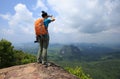 woman hiker enjoy the view hiking on mountain peak