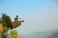 Woman hiker enjoy the view on mountain peak cliff Royalty Free Stock Photo