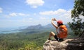 woman hiker enjoy the view on mountain top cliff Royalty Free Stock Photo