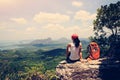 Woman hiker enjoy the view on mountain top cliff Royalty Free Stock Photo