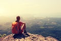 Woman hiker enjoy the view on mountain top cliff Royalty Free Stock Photo