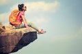 Woman hiker enjoy the view on mountain top cliff Royalty Free Stock Photo