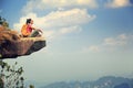 Woman hiker enjoy the view on mountain top cliff Royalty Free Stock Photo