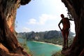 Woman hiker enjoy the view at sunrise mountain peak cliff Royalty Free Stock Photo